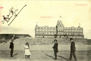Beachcombers posing for a photo in front of the Grand Hotel.